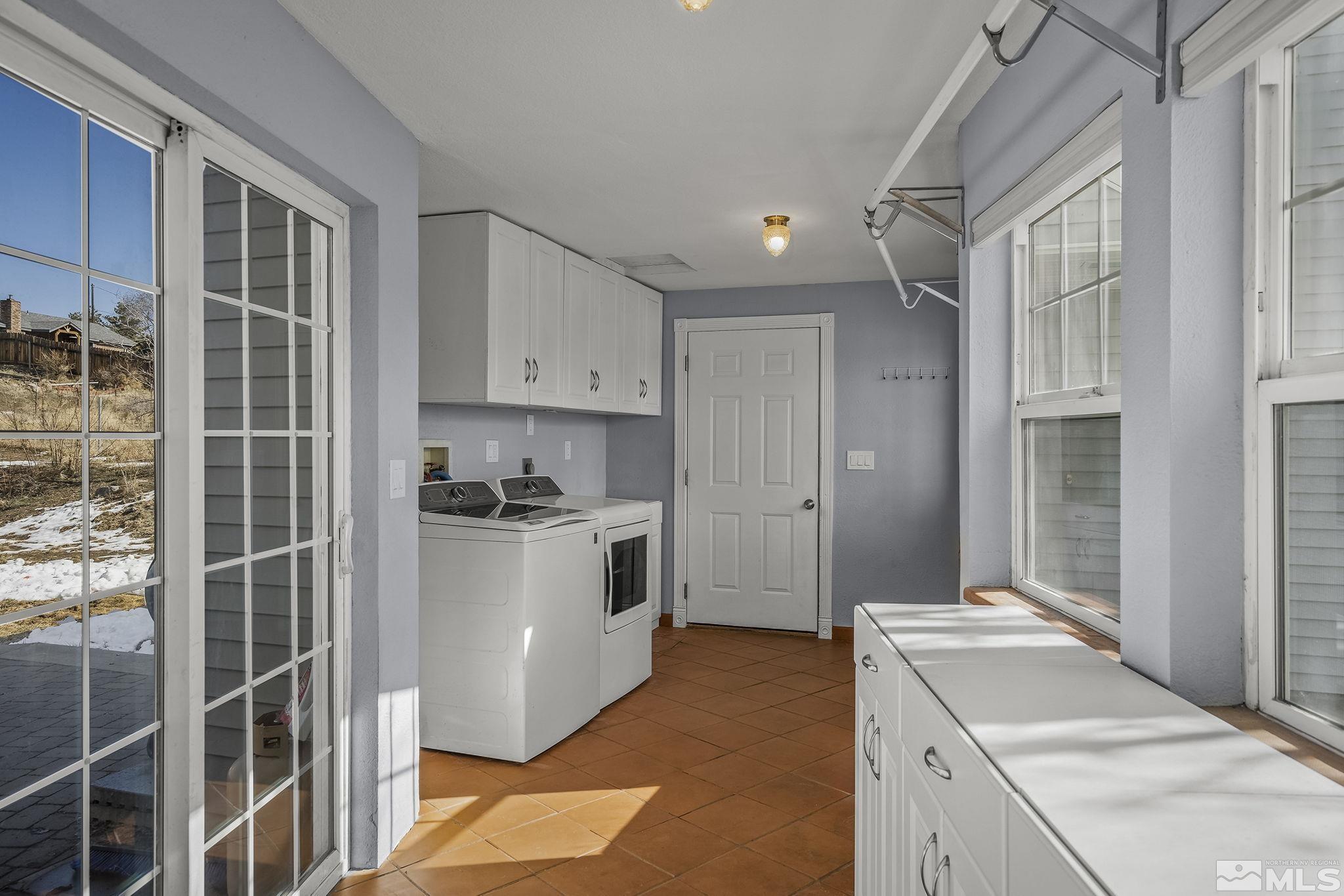 5960 Mallow Road Carson City, NV 89701 - Photo 14 of 34 a kitchen with a refrigerator and a sink