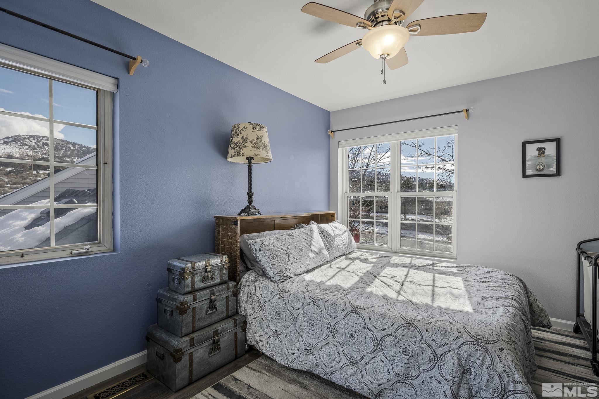 5960 Mallow Road Carson City, NV 89701 - Photo 17 of 34 a bedroom with a bed and a window