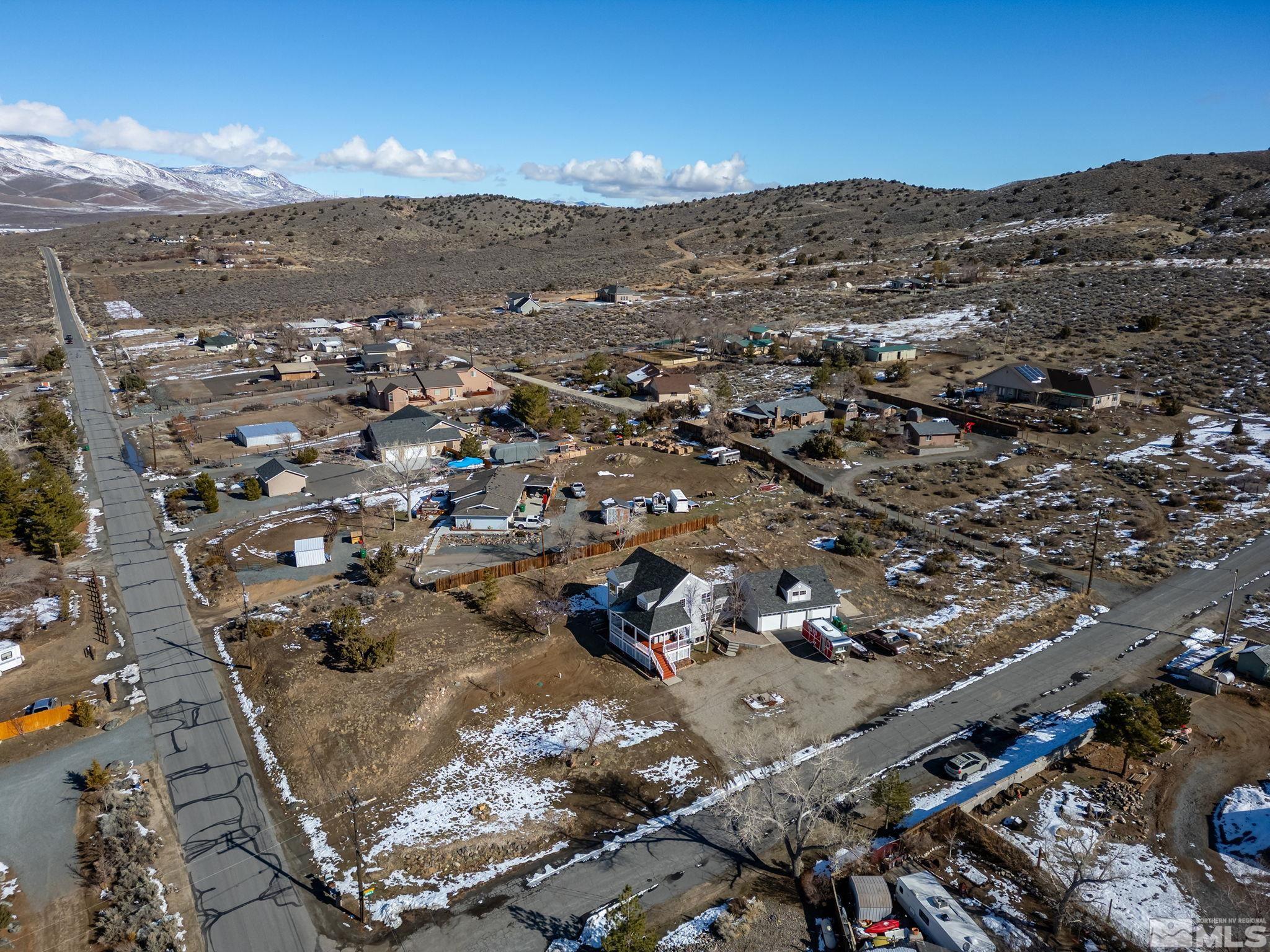 5960 Mallow Road Carson City, NV 89701 - Photo 22 of 34 an aerial view of residential building and parking space