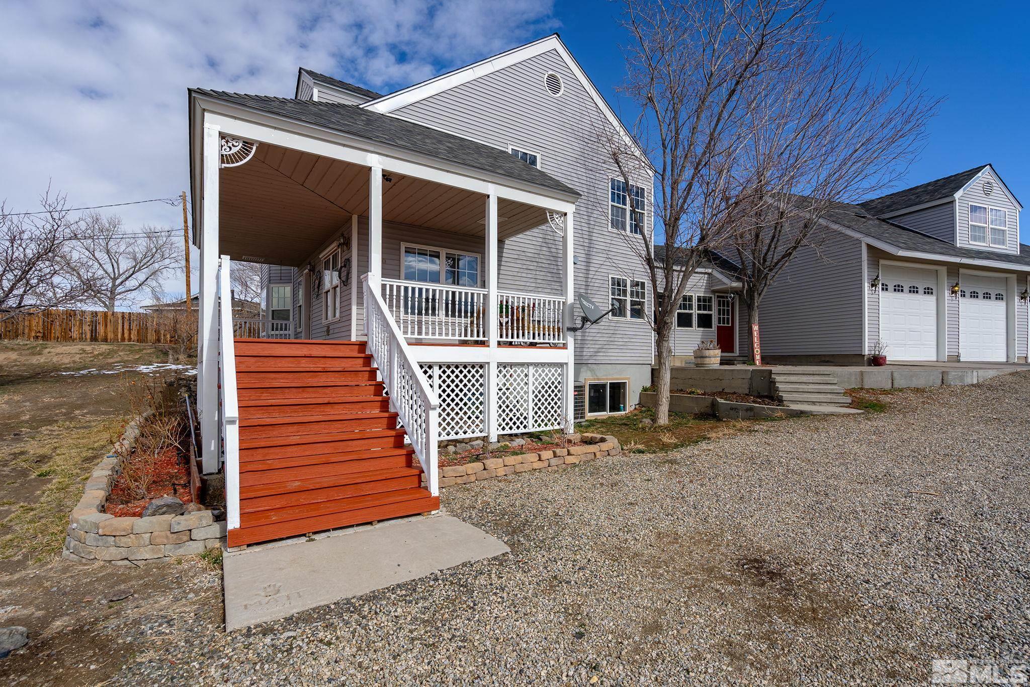 5960 Mallow Road Carson City, NV 89701 - Photo 3 of 34 a view of a house with wooden stairs