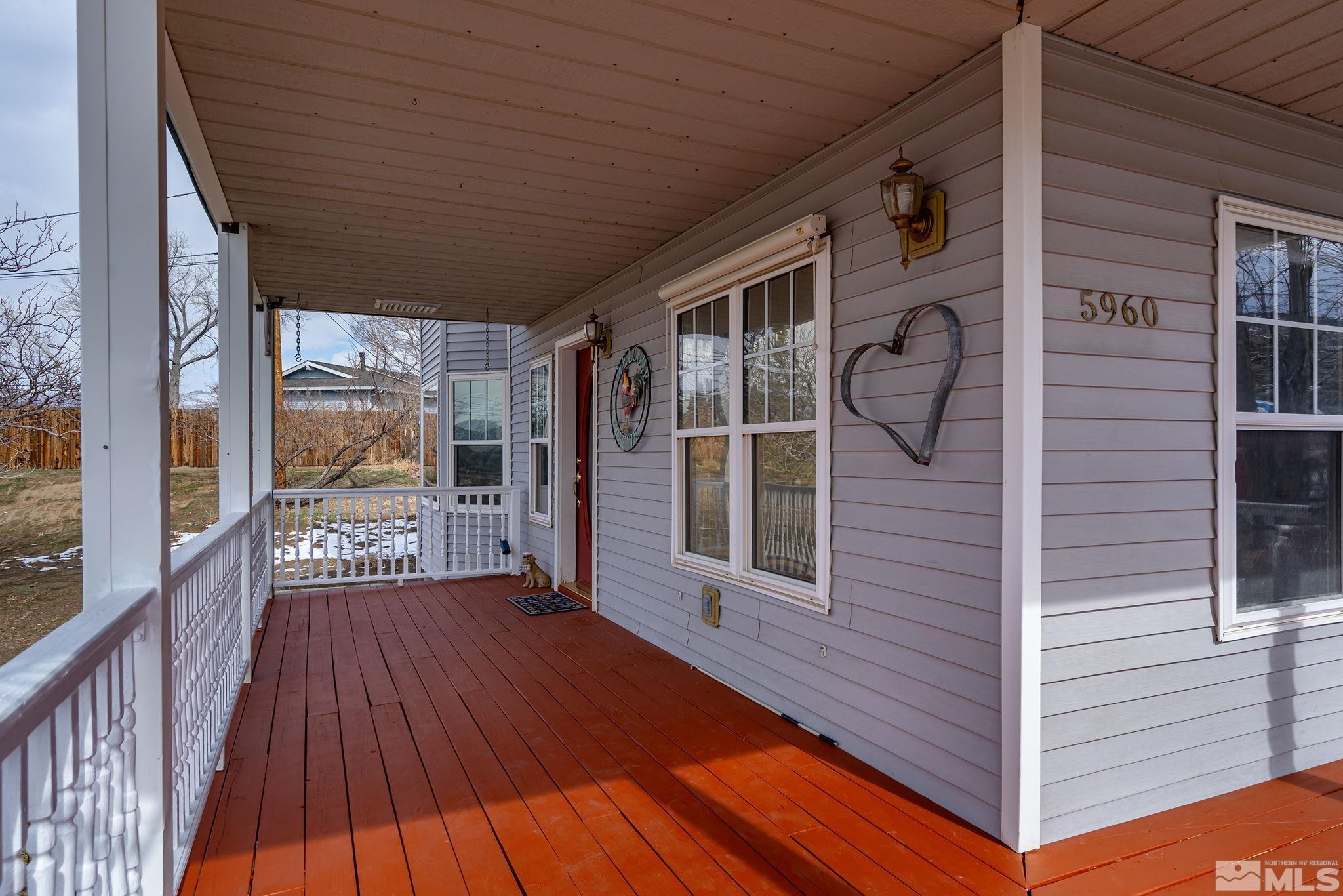 5960 Mallow Road Carson City, NV 89701 - Photo 4 of 34 a view of a balcony with wooden floor