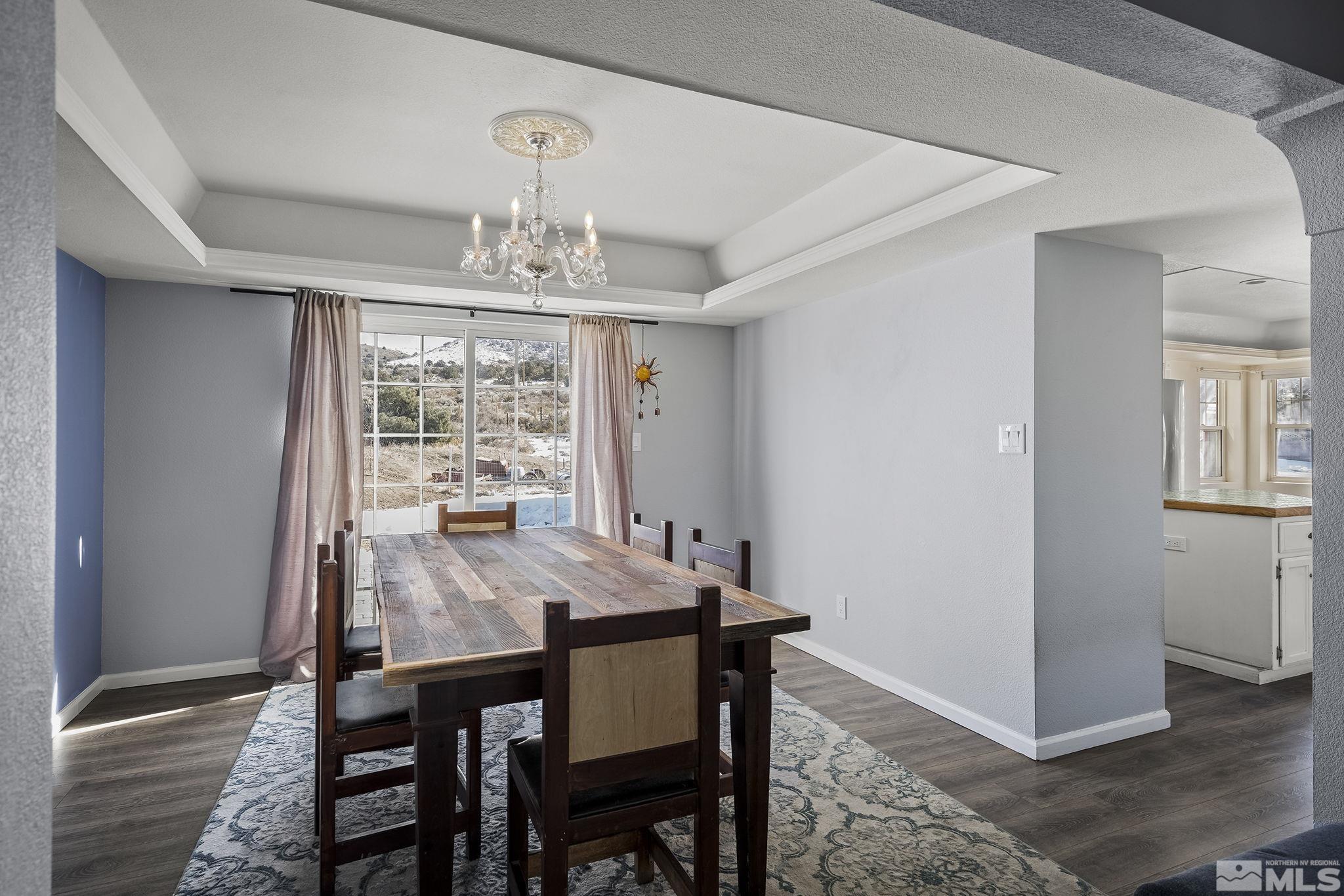 5960 Mallow Road Carson City, NV 89701 - Photo 8 of 34 a view of a dining room with furniture window and wooden floor