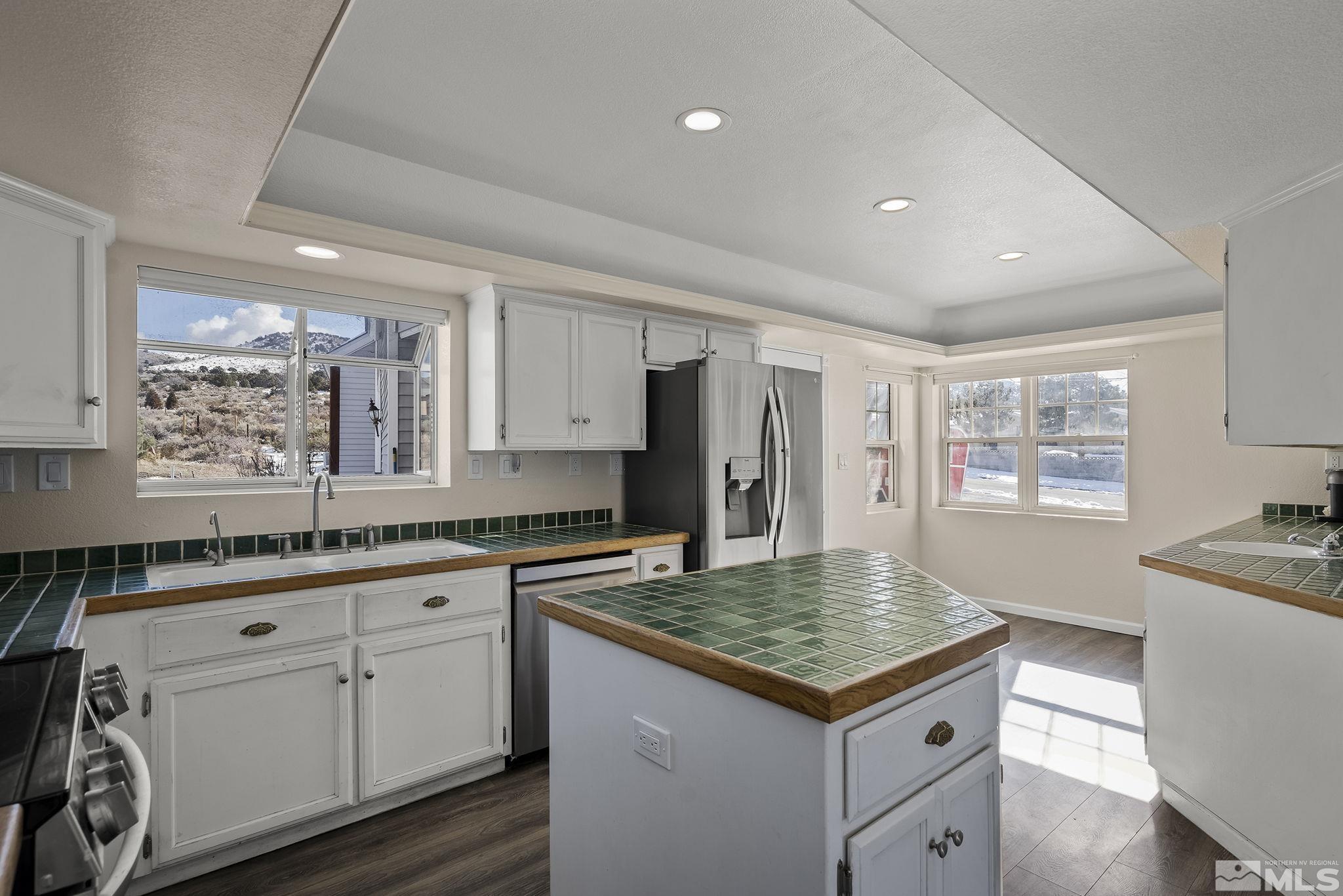 5960 Mallow Road Carson City, NV 89701 - Photo 9 of 34 a kitchen with a stove a sink dishwasher and a refrigerator
