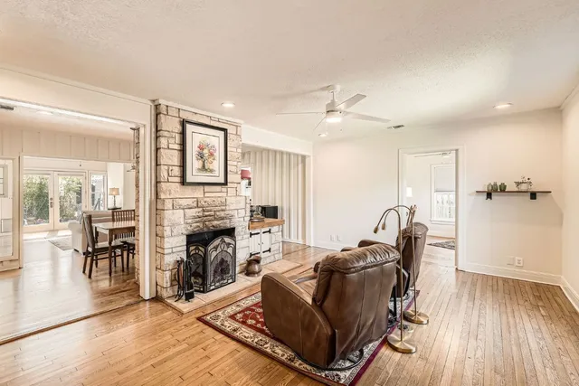 a living room with furniture and a fireplace