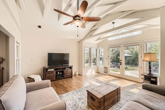 a living room with furniture and a flat screen tv