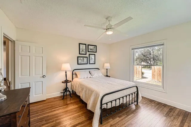 a bedroom with a bed and a table