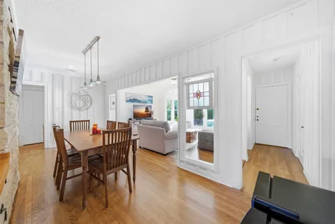 a living room with furniture ceiling fan and a rug