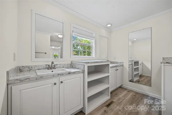 a bathroom with a sink and a mirror
