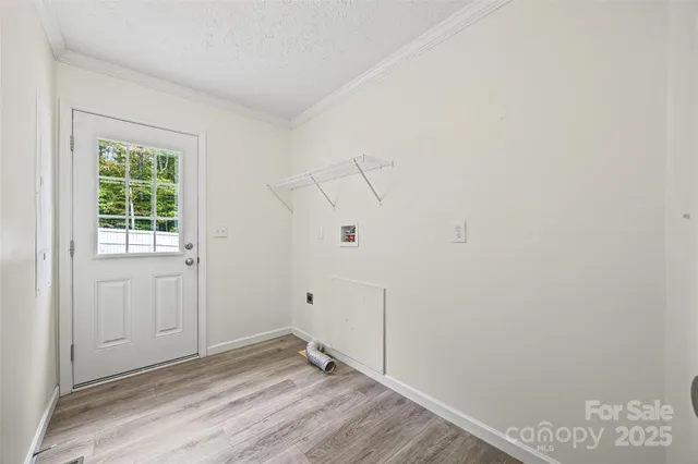 a view of room with hardwood floor and window