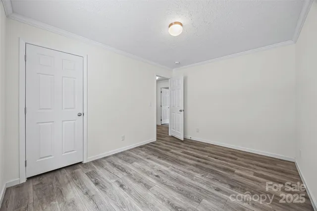 a view of room with wooden floor