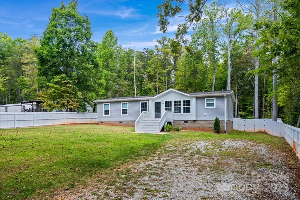 a view of a house with a big yard