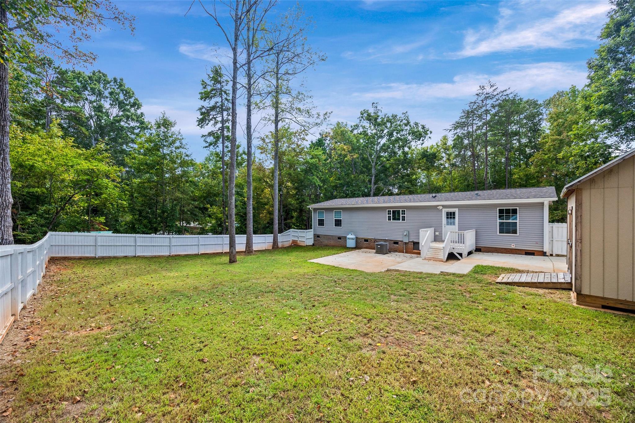 2025 Kisatchie Drive Hickory Grove, SC 29717 - Photo 27 of 33 a view of a house with backyard and sitting area