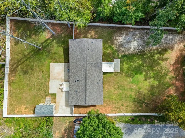 an aerial view of residential house with outdoor space