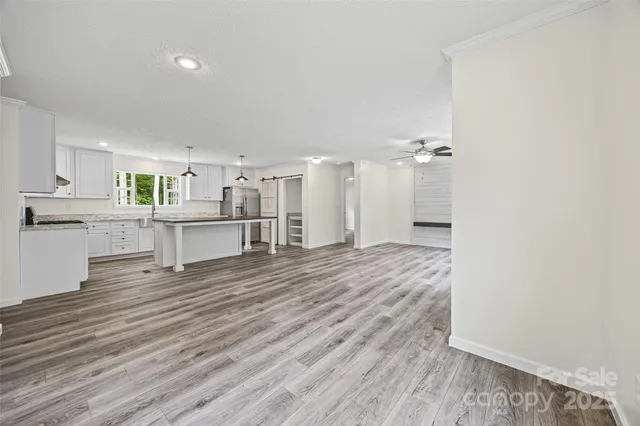 a view of a kitchen with wooden floor