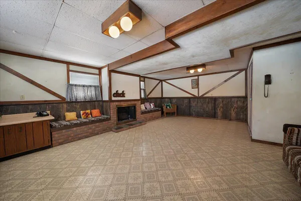 a view of an empty room with a fireplace