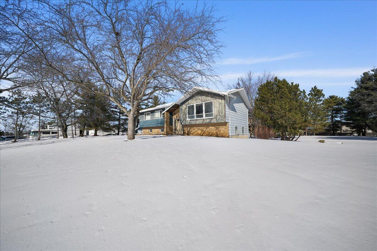 805 West Wilson Street Hebron, IN 46341 - Photo 2 of 27 a view of house with snow on the road