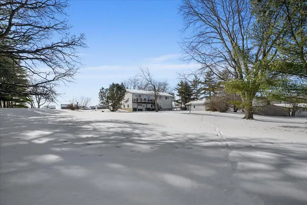 a view of a road with a building in the background