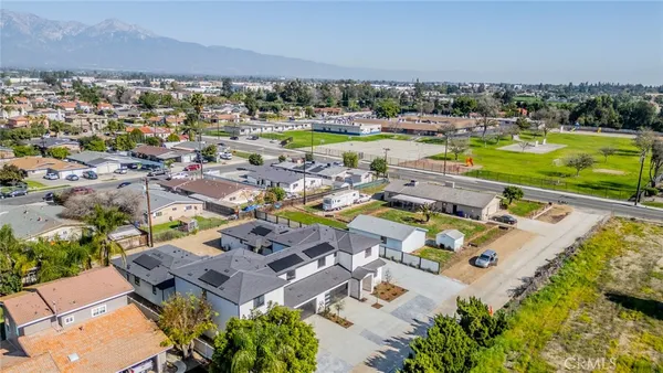 an aerial view of a house with a swimming pool yard and outdoor seating