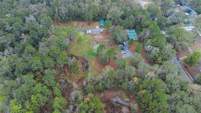 an aerial view of a houses with outdoor space and street view