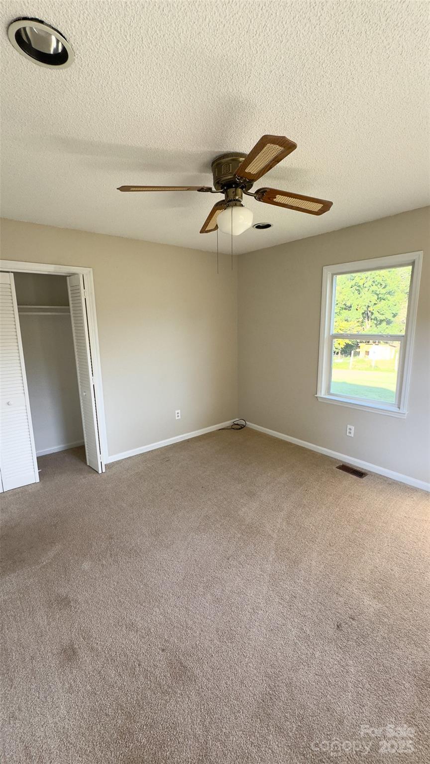 3014 Morgan Mill Road Monroe, NC 28110 - Photo 12 of 26 a view of an empty room with a window
