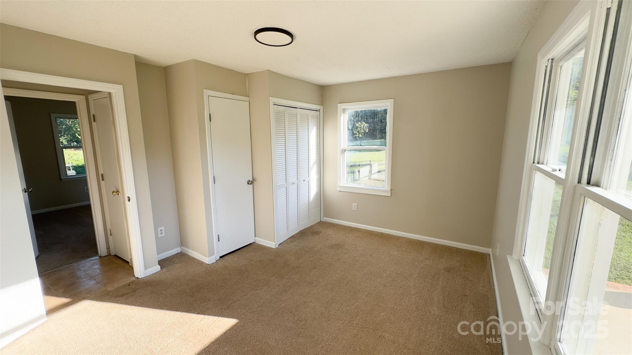 3014 Morgan Mill Road Monroe, NC 28110 - Photo 13 of 26 an empty room with windows