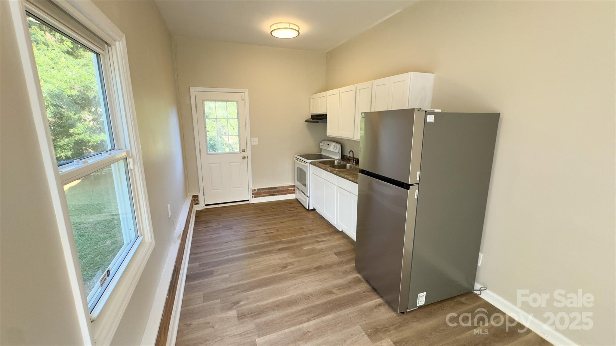 3014 Morgan Mill Road Monroe, NC 28110 - Photo 14 of 26 a view of a kitchen from the hallway
