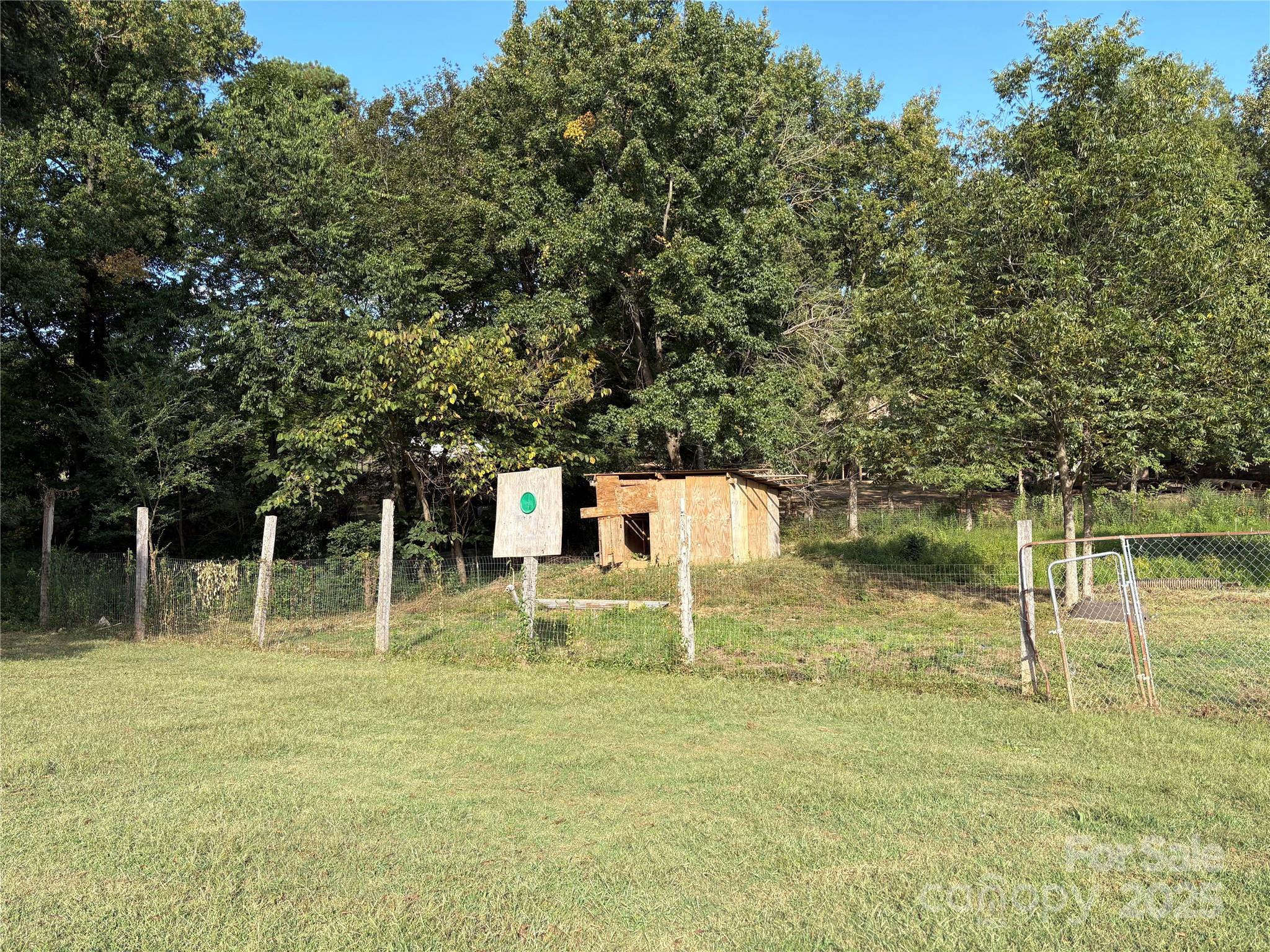 3014 Morgan Mill Road Monroe, NC 28110 - Photo 23 of 26 a backyard of a house with lots of green space