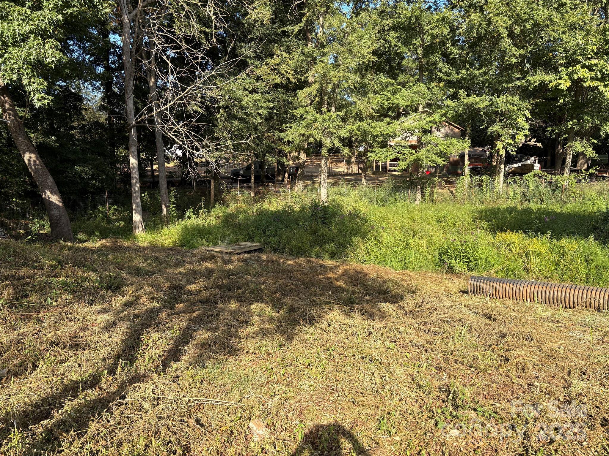 3014 Morgan Mill Road Monroe, NC 28110 - Photo 26 of 26 a view of a lake view with a large trees
