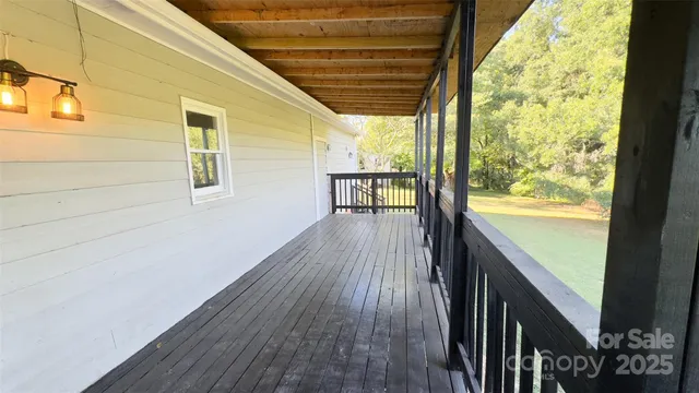 a view of outdoor space with wooden floor and city view