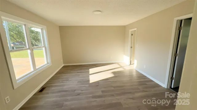 a view of an empty room and window