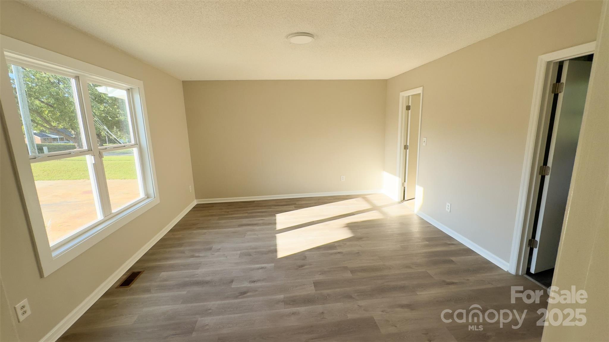 3014 Morgan Mill Road Monroe, NC 28110 - Photo 8 of 26 a view of an empty room and window