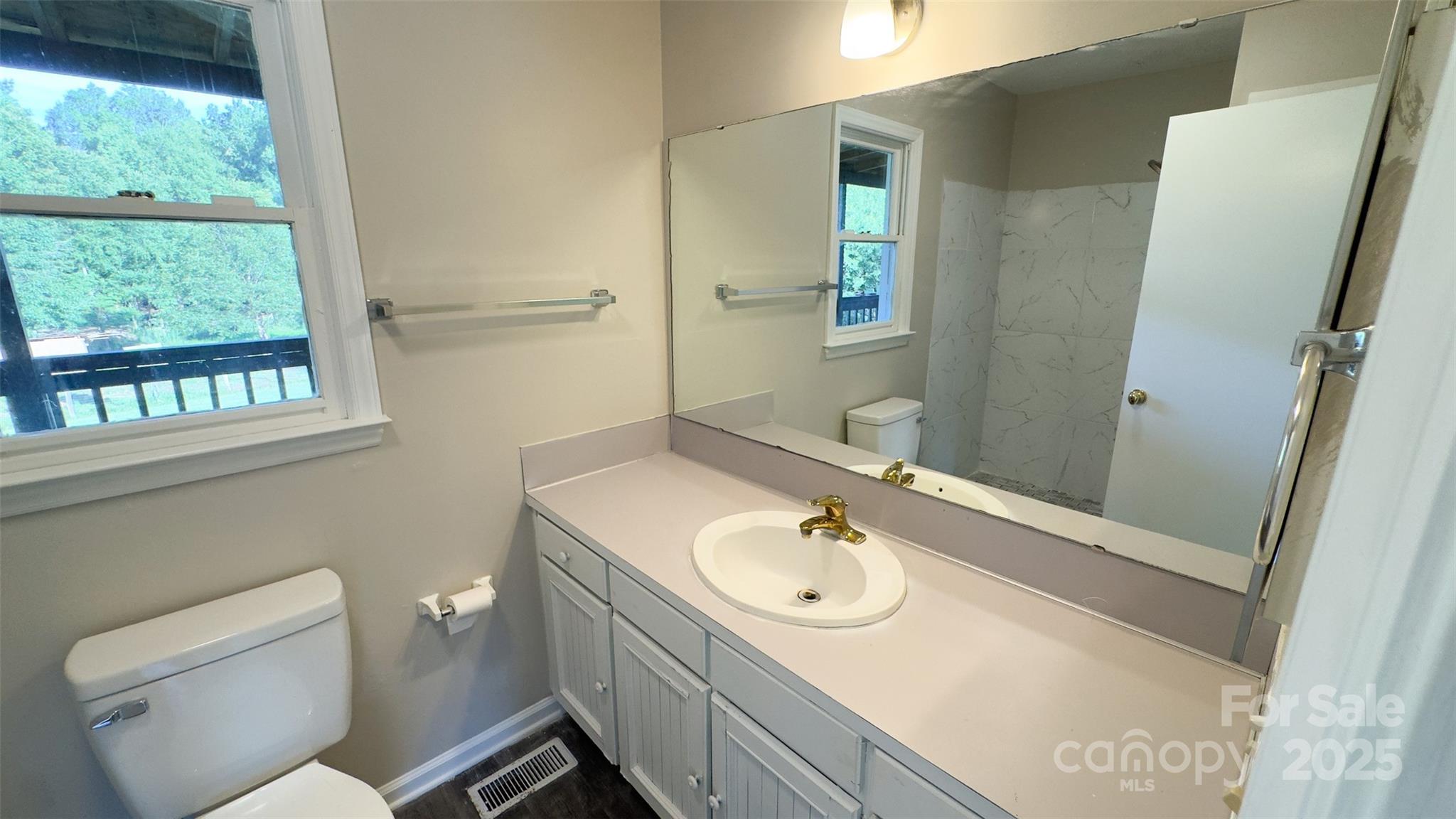 3014 Morgan Mill Road Monroe, NC 28110 - Photo 9 of 26 a bathroom with a sink toilet and tub