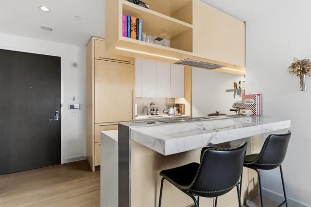 a dining table with chairs and wooden floor