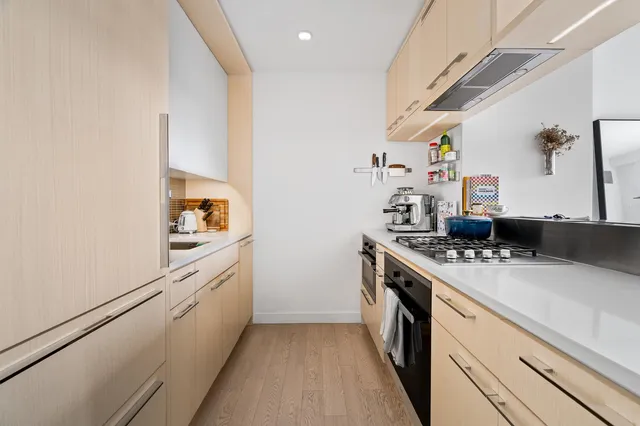 a kitchen with a stove and a refrigerator