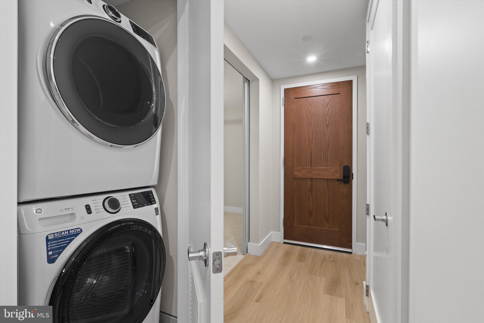 801 North Fairfax Street, Unit 318 Alexandria, VA 22314 - Photo 15 of 26 a view of a hallway with washer and dryer