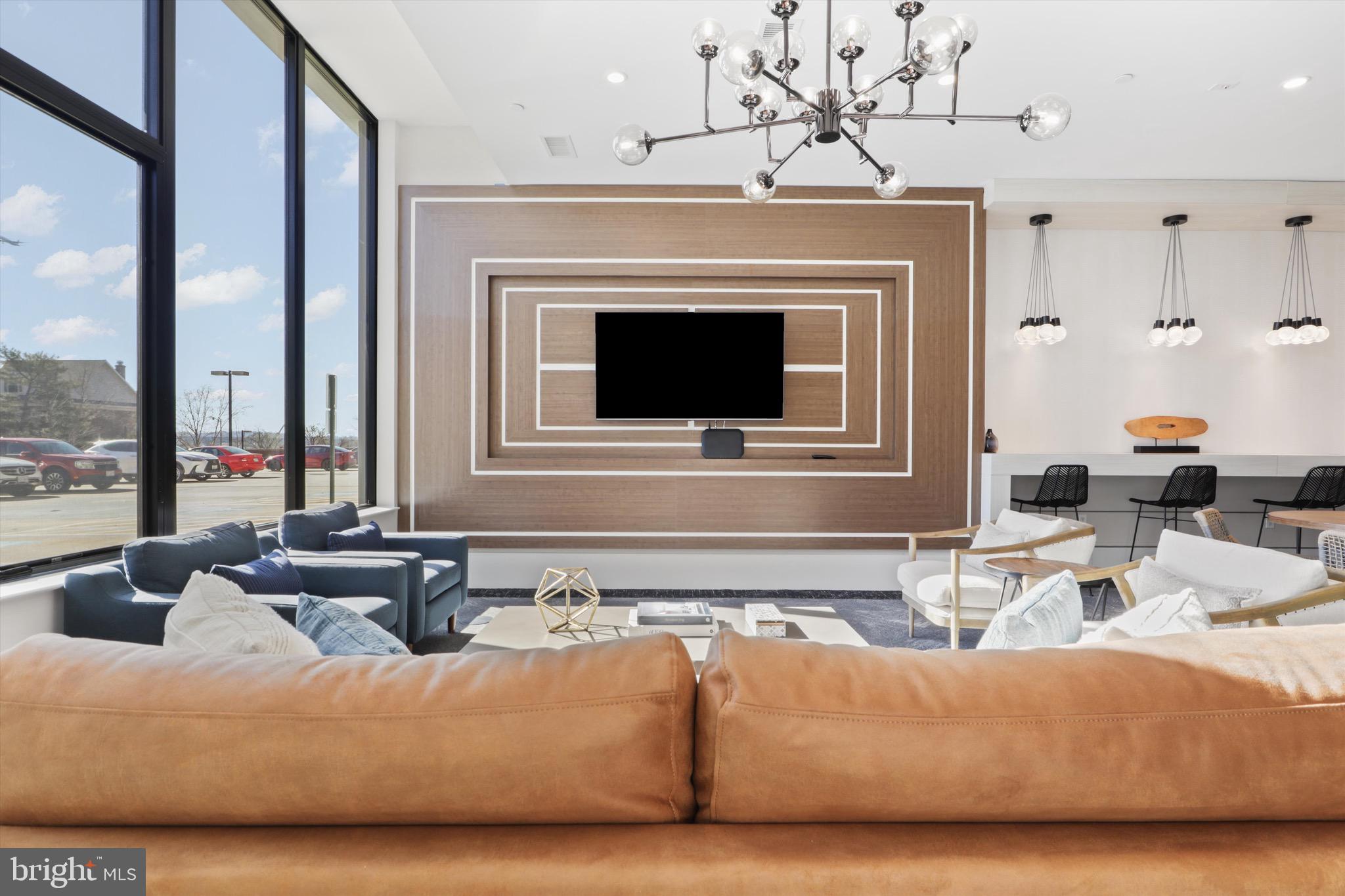 801 North Fairfax Street, Unit 318 Alexandria, VA 22314 - Photo 18 of 26 a living room with furniture and a fireplace