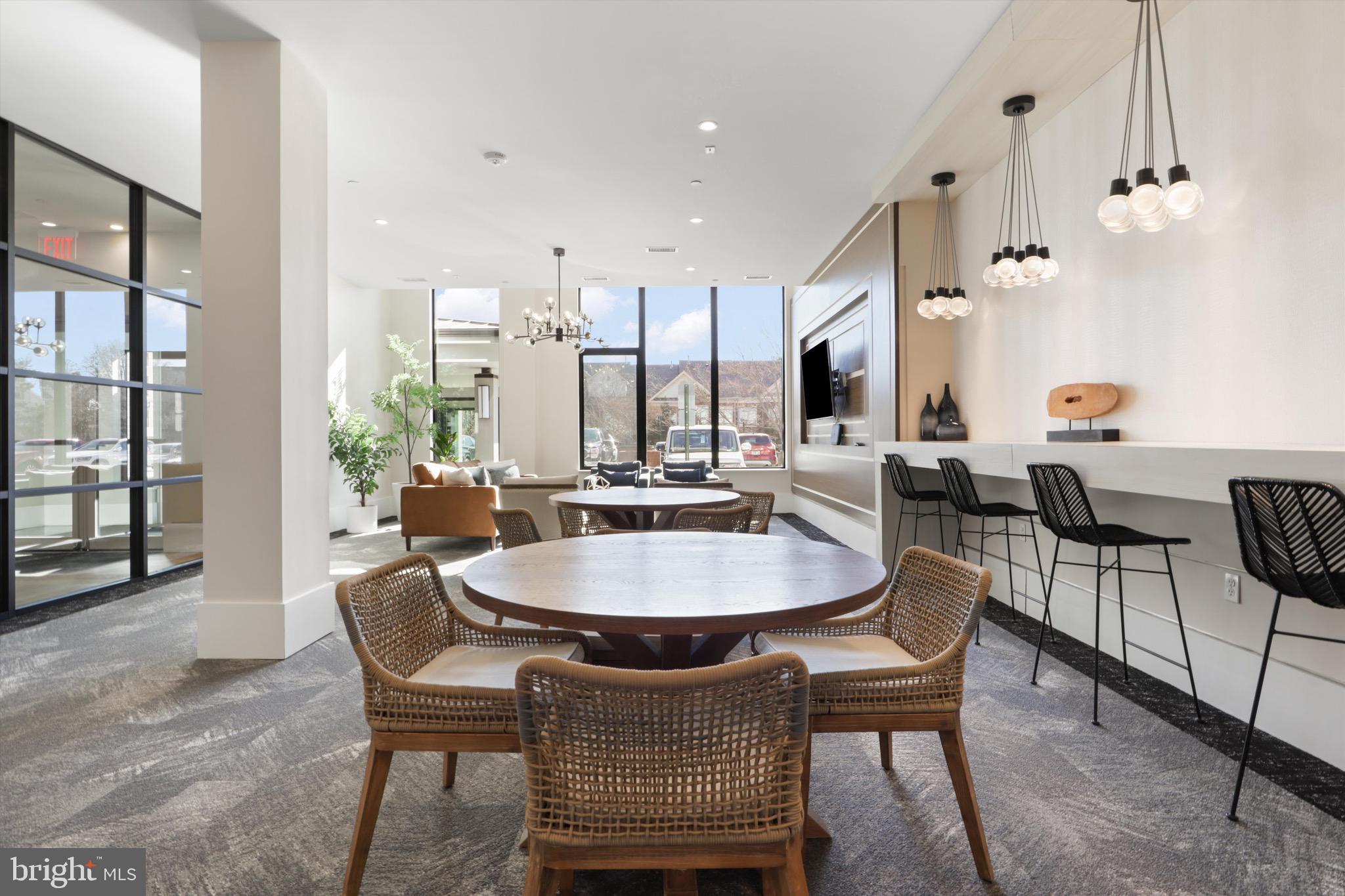 801 North Fairfax Street, Unit 318 Alexandria, VA 22314 - Photo 20 of 26 a dining room with furniture and window