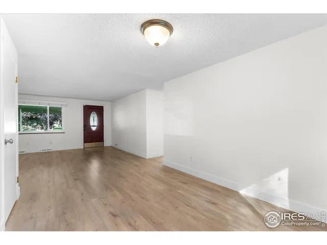 a view of an empty room and window