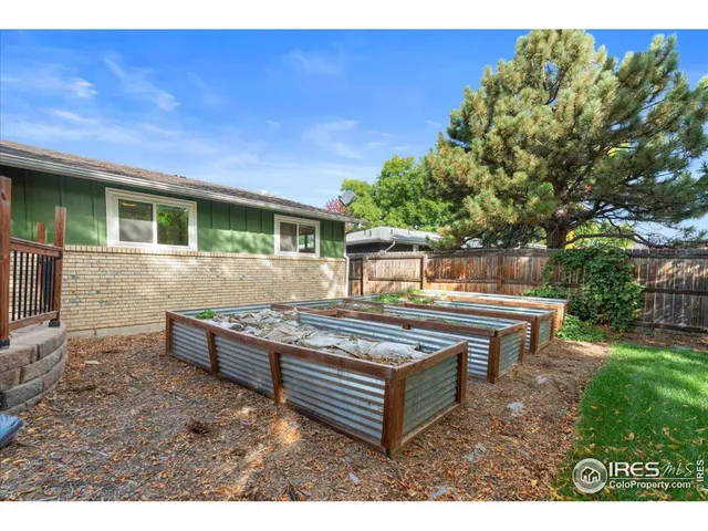 a view of a backyard with sitting area