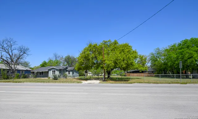 a view of swimming pool with trees in the background