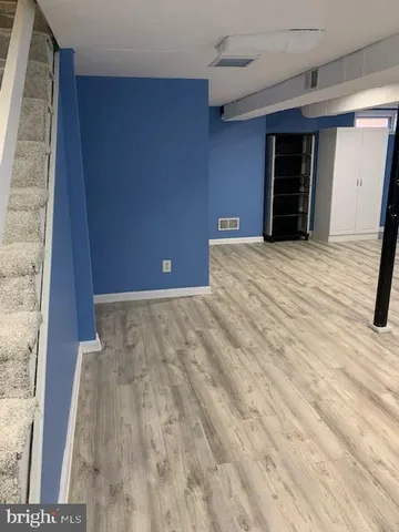 a view of a livingroom with wooden floor