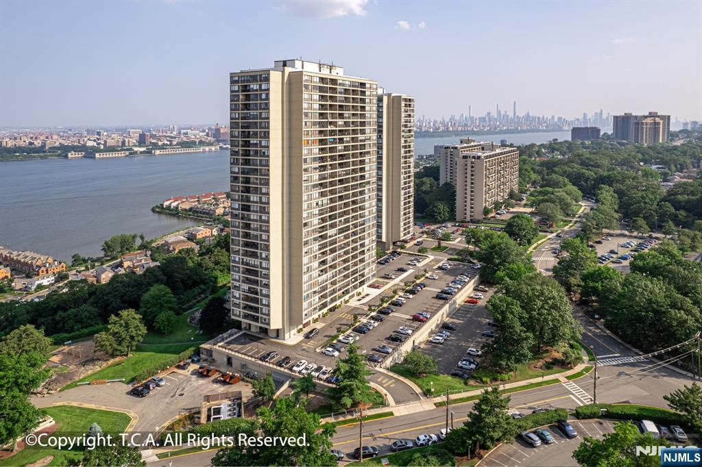 6 Horizon Road, Unit 906 Fort Lee, NJ 07024 - Photo 11 of 12 a view of a city with tall buildings
