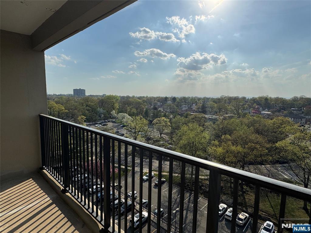 6 Horizon Road, Unit 906 Fort Lee, NJ 07024 - Photo 4 of 12 a balcony with wooden floor in back