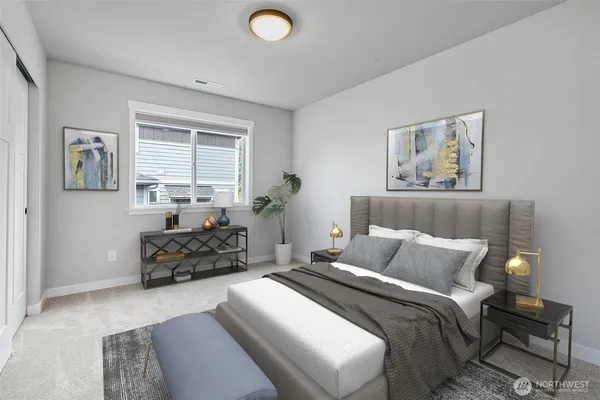 a bedroom with bed and furniture
