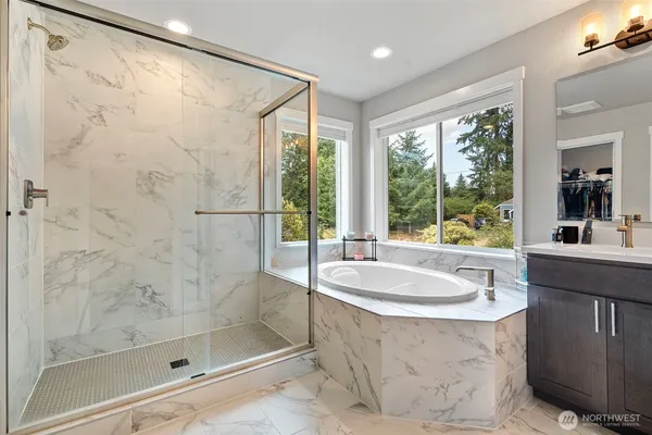 a bathroom with a bathtub and a sink