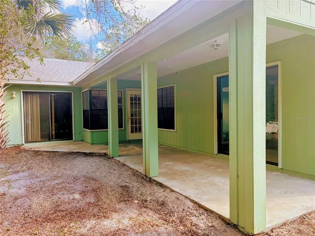 a view of a brick house with a large windows
