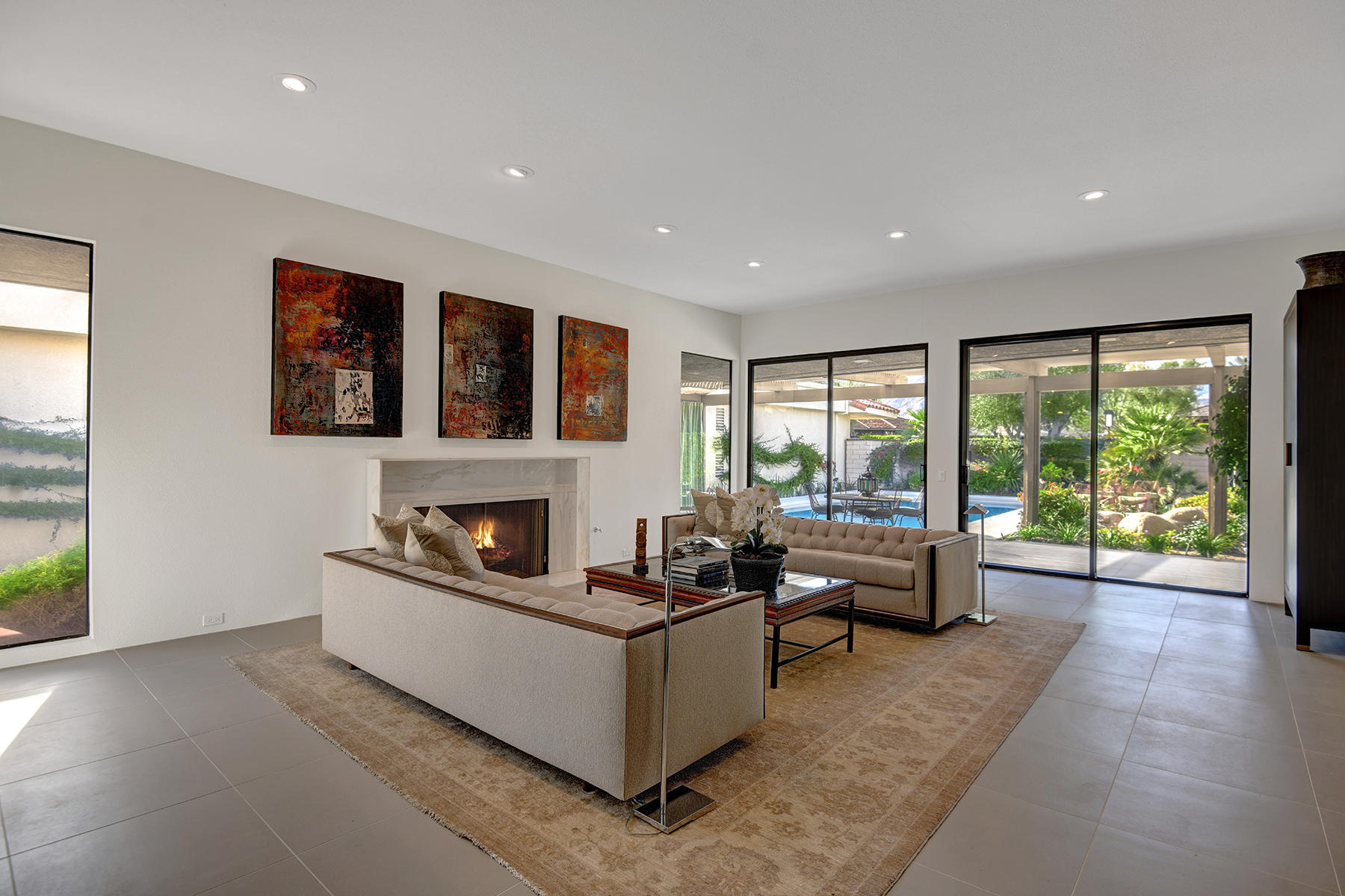 21 Colgate Drive Rancho Mirage, CA 92270 - Photo 3 of 38 a living room with furniture large window and a flat screen tv