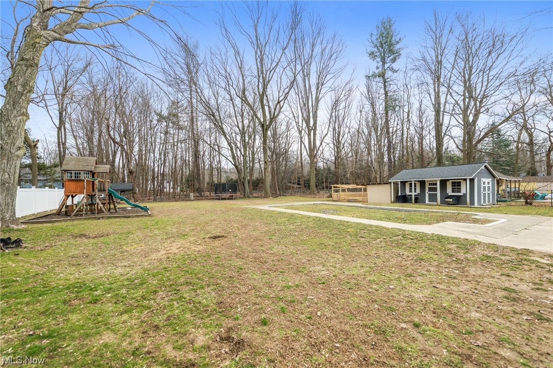 2425 McMackin Road Madison, OH 44057 - Photo 45 of 46 View of yard featuring a playground
