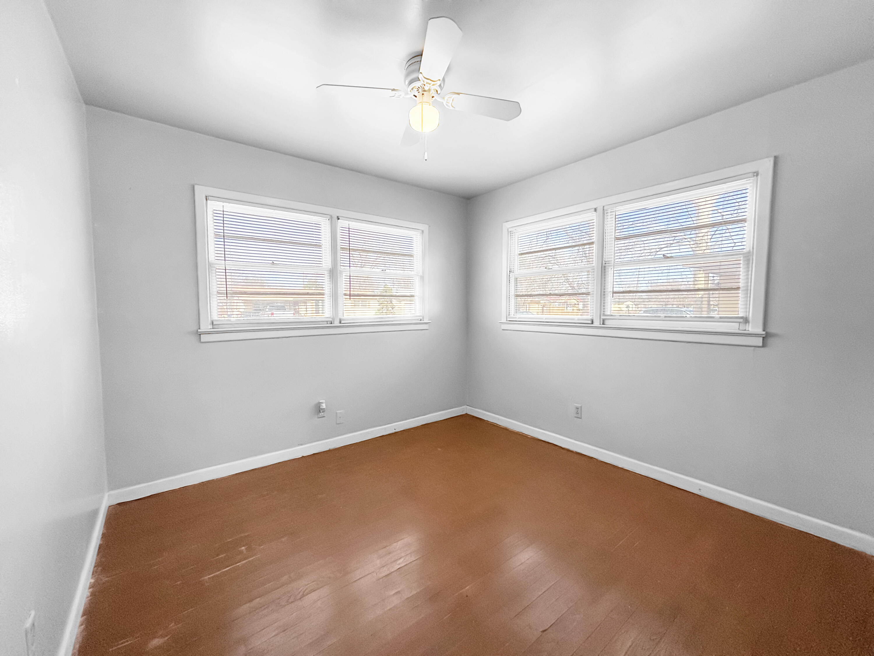 4411 45th Street Lubbock, TX 79414 - Photo 27 of 44 an empty room with windows and fan