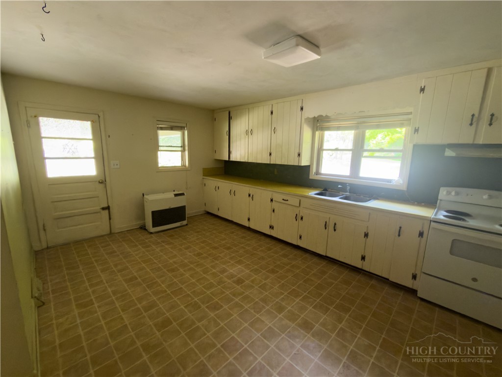 1205 Bamboo Road Boone, NC 28607 - Photo 3 of 17 a view of a kitchen with wooden floor